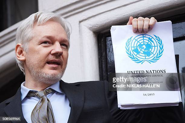 WikiLeaks founder Julian Assange addresses the media holding a printed report of the judgement of the UN's Working Group on Arbitrary Detention on...