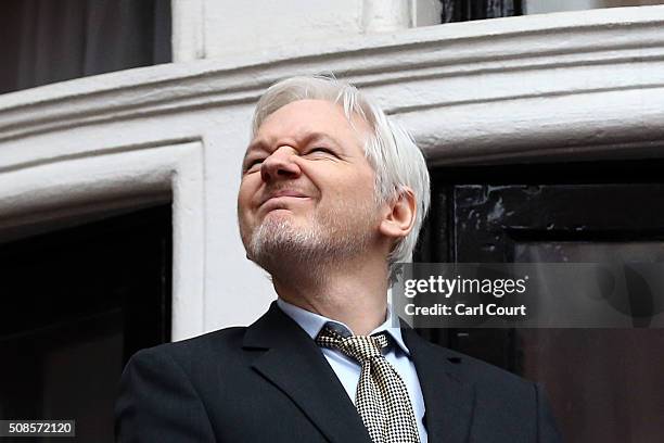 Wikileaks founder Julian Assange squints in the sunlight as he prepares to speak from the balcony of the Ecuadorian embassy where he continues to...