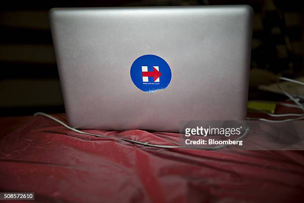 Campaign sticker for Hillary Clinton, former Secretary of State and 2016 Democratic presidential candidate, sticks to an Apple Inc. Laptop computer...