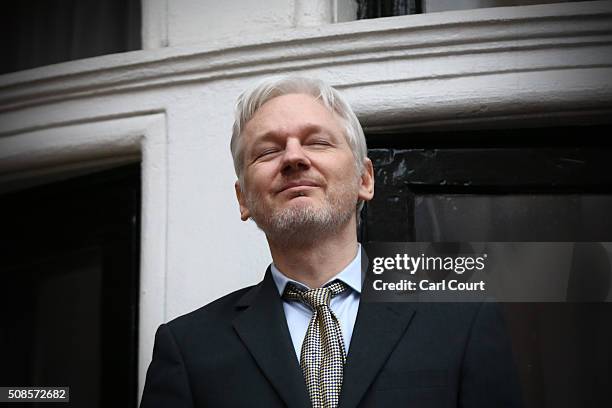 Wikileaks founder Julian Assange squints in the sunlight as he prepares to speak from the balcony of the Ecuadorian embassy where he continues to...