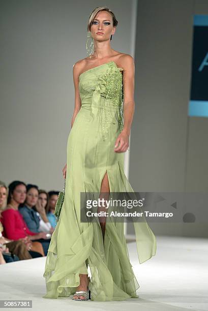 Model walks the runway wearing an Alquimia design during Fashion Week of The Americas May 16, 2004 in Miami, Florida.