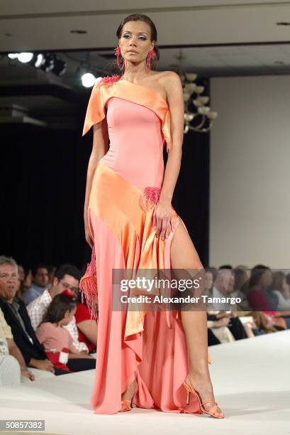 Model walks the runway wearing an Alquimia design during Fashion Week of The Americas May 16, 2004 in Miami, Florida.