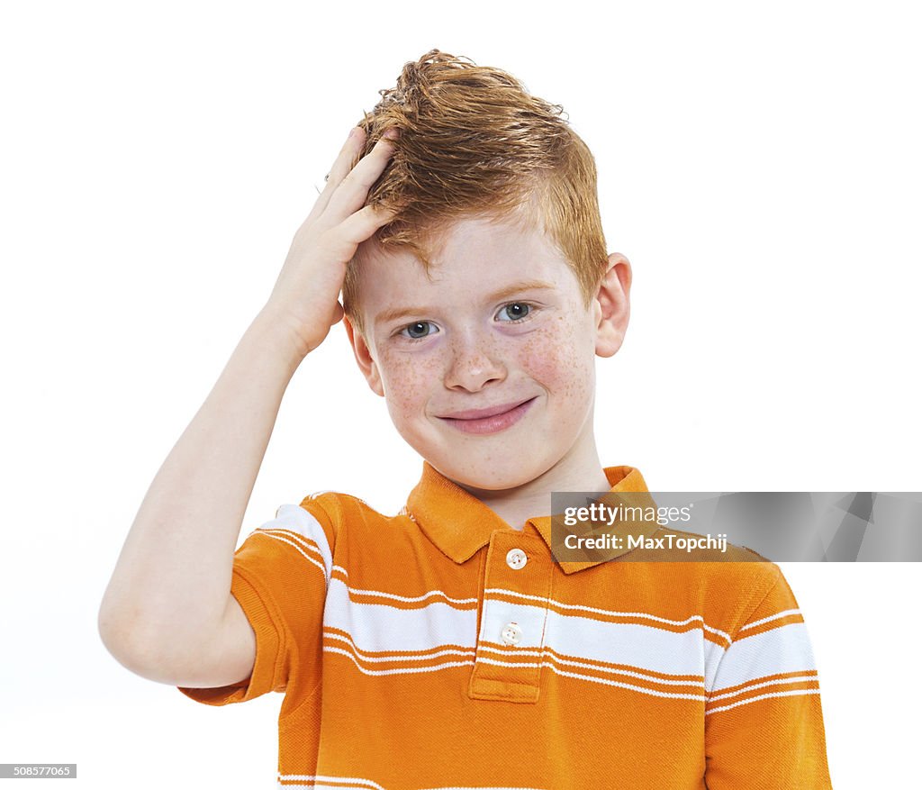 Portrait of a cute red-haired boy