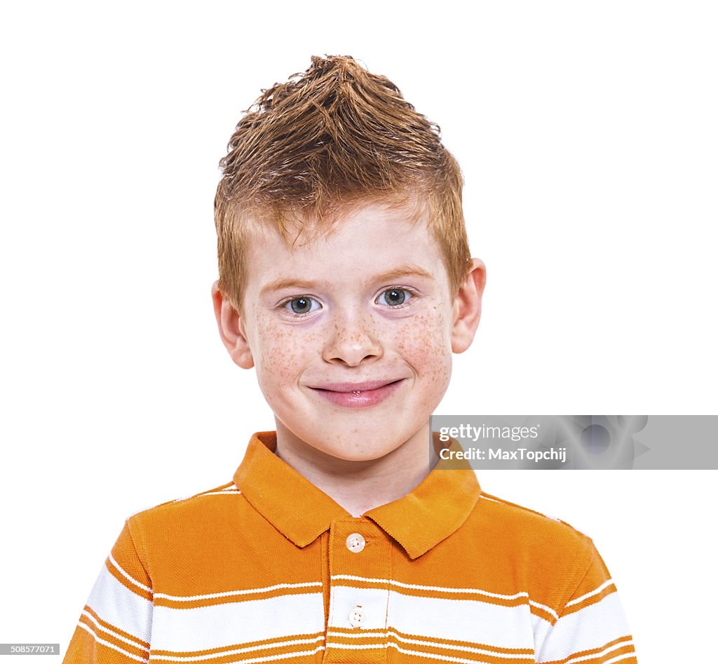 Portrait of a cute red-haired boy