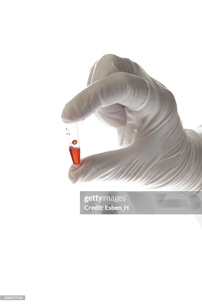 Hand with testtube isolated on white