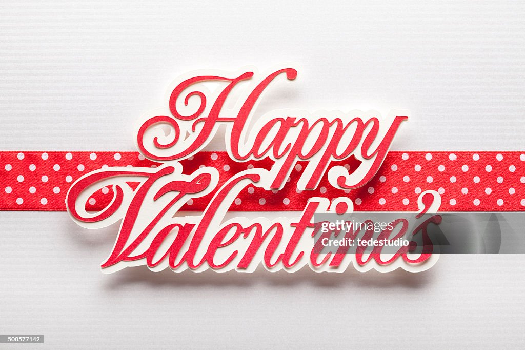 Happy Valentine's - paper sign on paper background