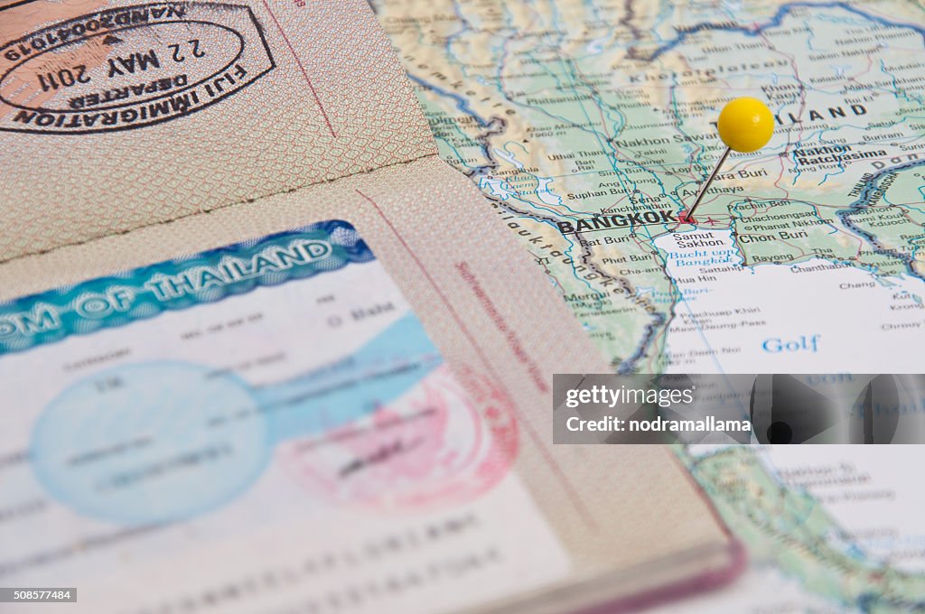 Close Up of Thailand Visum, Passport, Pin and Thailand Map.