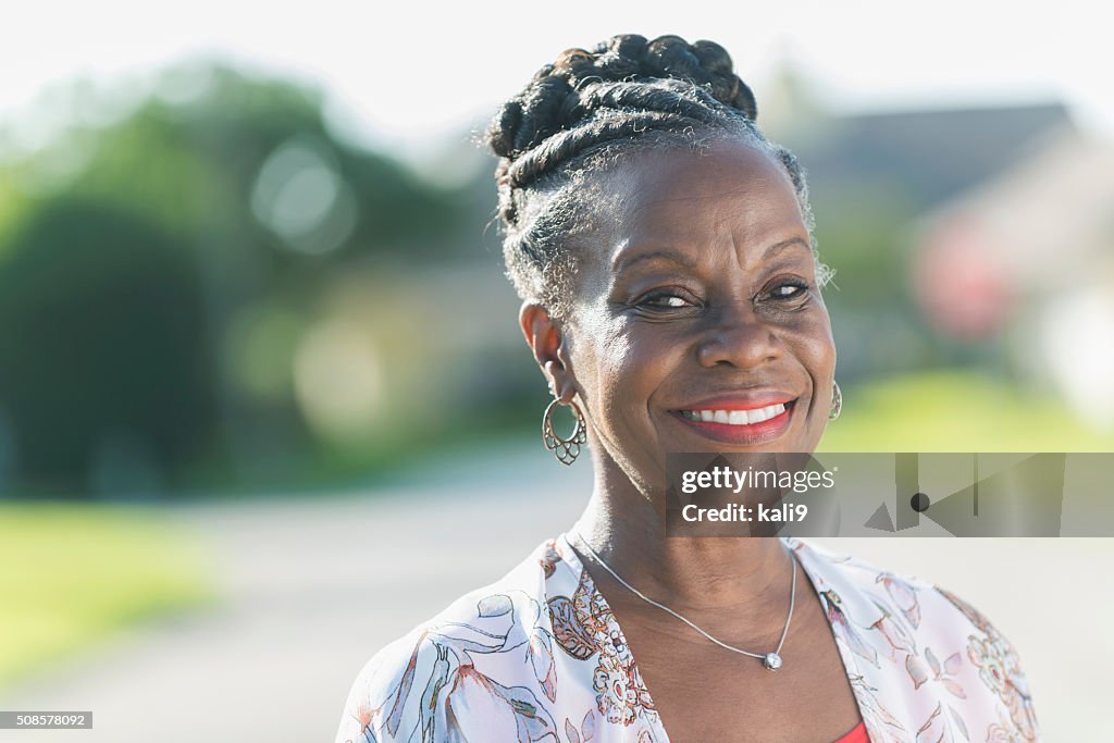 Face of a mature African American woman outdoors