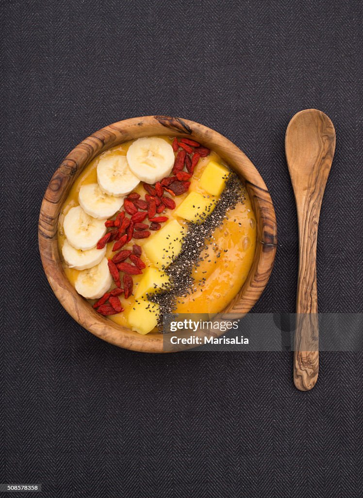 Smoothie bowl with goji, banana, mango and chia seeds