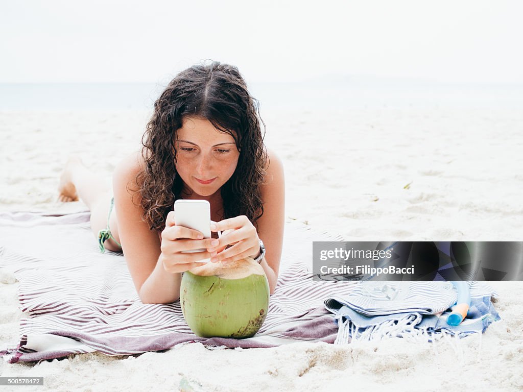 Young Woman Browsing The Net During Vacations