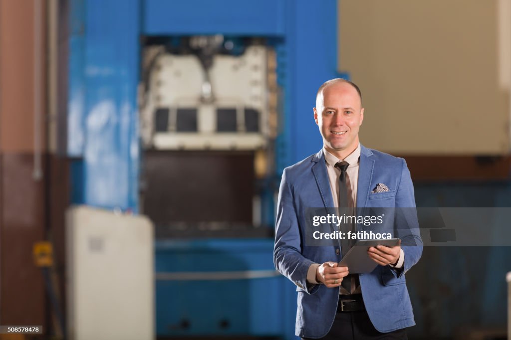 Young Businessman with Tablet