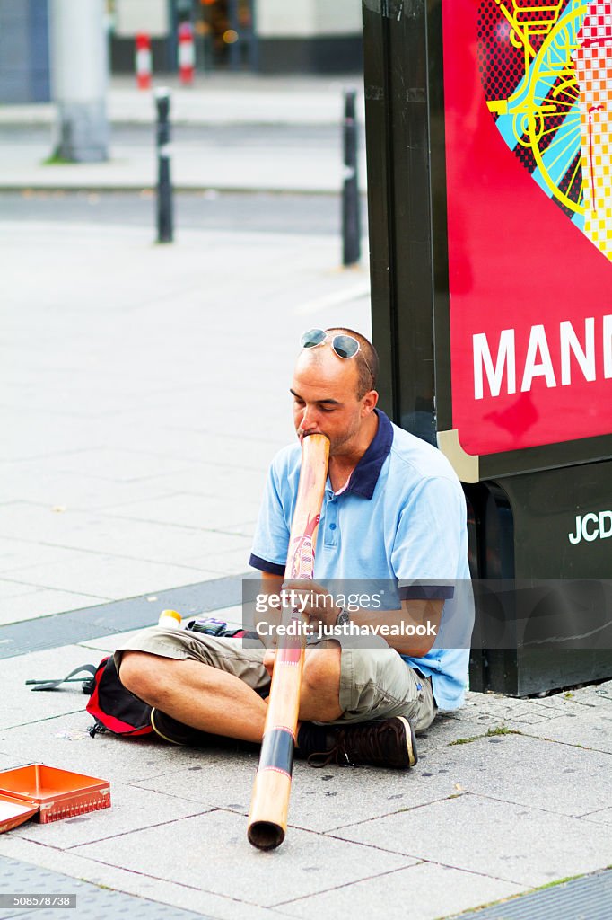 Busker playing didgeridoo