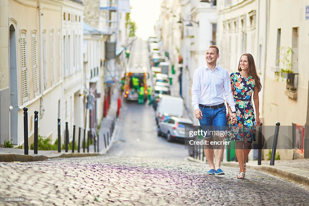 Young romantic couple walking on Montmartre