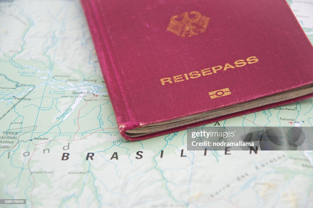 Close Up of Passport and map of Brazil.