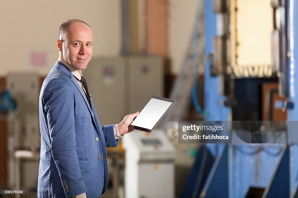 Young Businessman with Tablet