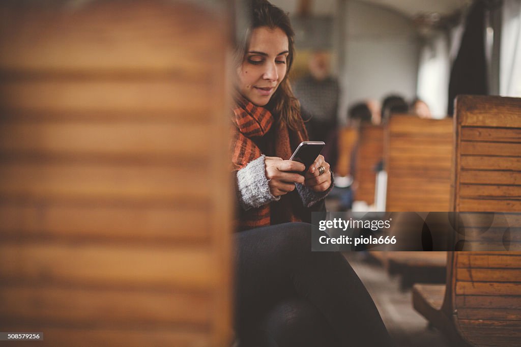 Woman travelling alone in a old train