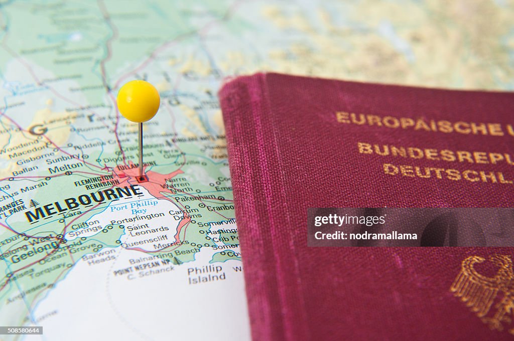 Close Up of Pin on map and Passport, Melbourne, Australia.