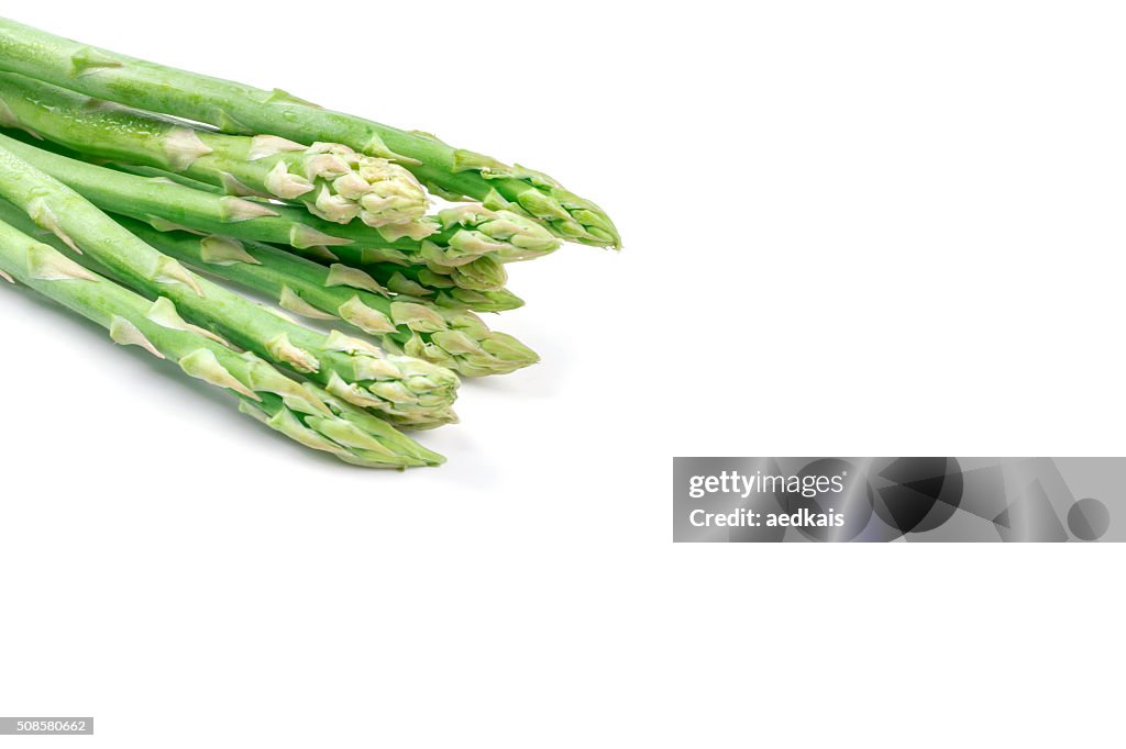 Fresh green asparagus on white