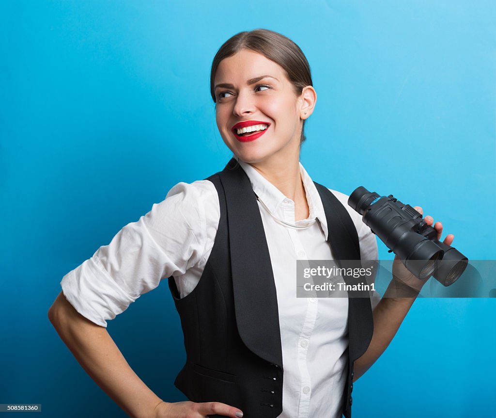Business woman with a binoculars