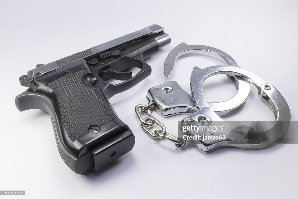 Steel gun and handcuffs to stop criminals