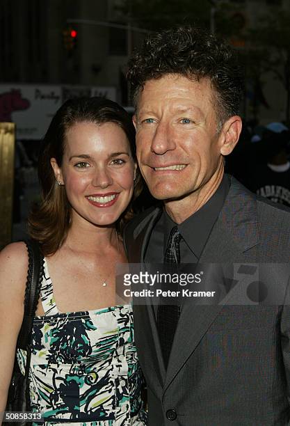 Singer Lyle Lovett and girlfriend April Kimble attend the Rockefeller Center Motorcycle Show Opening Night Bash May 19, 2004 in New York City.