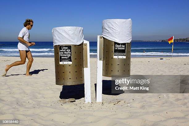 Signs on garbage bins encourage the responsible disposal of rubbish, including cigarette butts, on Bondi Beach May 20, 2004 in Sydney, Australia....