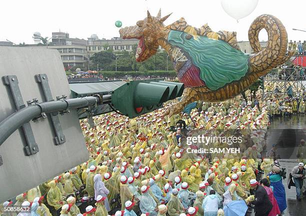 Dinosaur balloon fly above the crowds during the inauguration ceremony in front of Presidential Palace in Taipei 20 May 2004. Taiwan's President Chen...