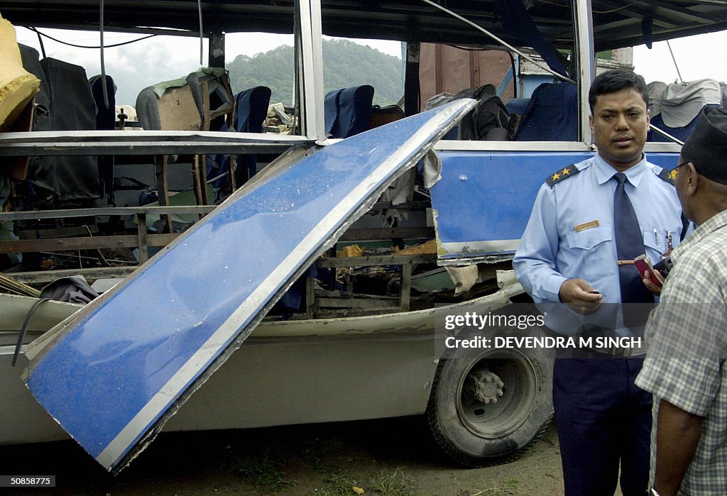 A Nepalese traffic officer (R) speaks wi