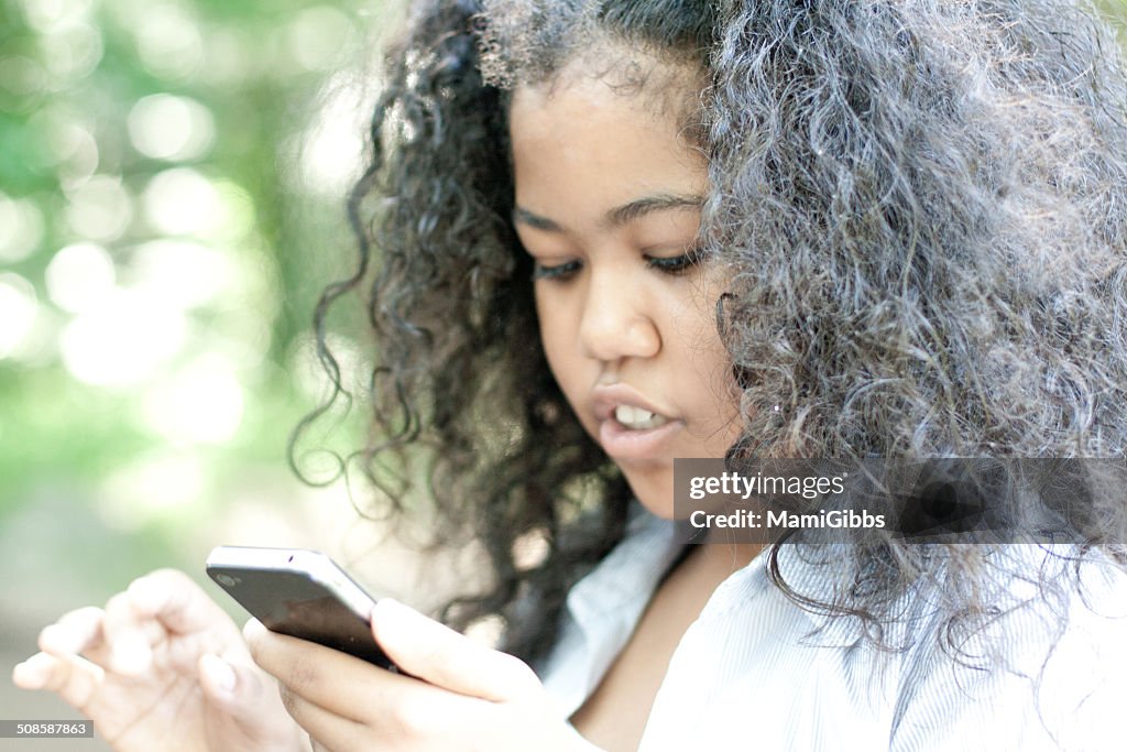 Girl looking smartphone