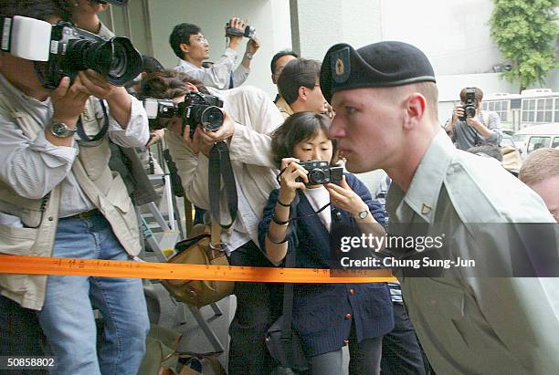 John Humphreys, from the United States Forces Korea arrives at a police station on May 20, 2004 in Seoul South Korea. Humphreys and four U.S....