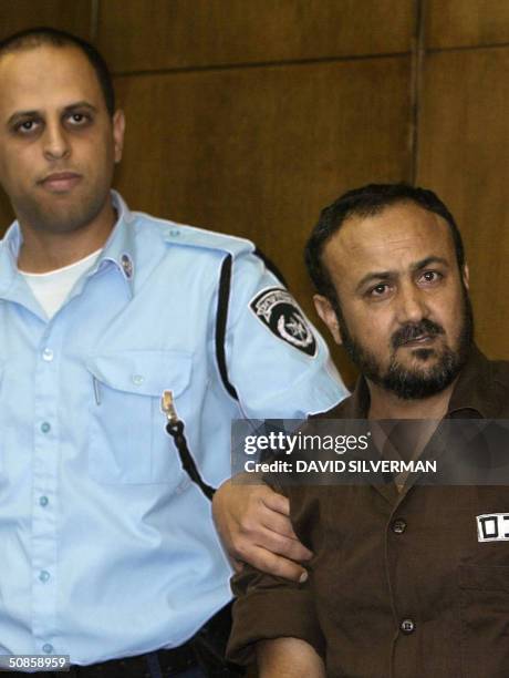 Palestinian West Bank Fatah leader Marwan Barghuti arrives in the Tel Aviv district court 20 May 2004. Barghuti, who was found guilty on several...