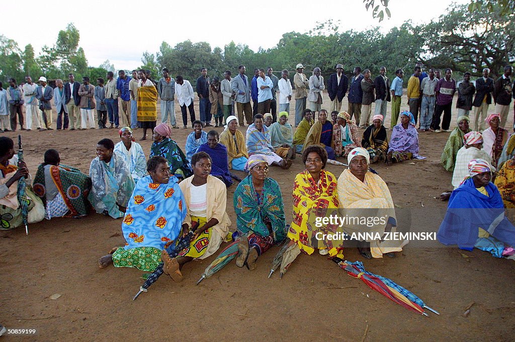 Voters wait for the polls to open at a p