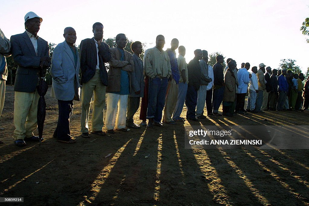 Voters wait for the polls to open at a p