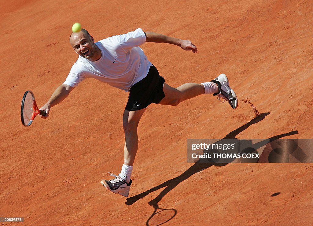 US tennisman Andre Agassi runs to hit th