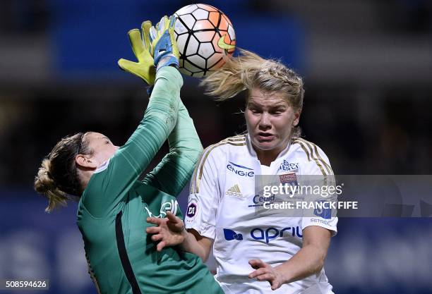 Lyon's French forward Ada Hegerberg vies with Paris Saint-Germain's German goalkeeper Ann-Katrin Berger during the French Women's D1 football match...