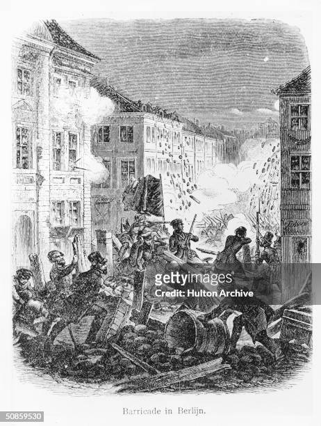 Fighting at a barricade in a Berlin street during the revolution of 1848.