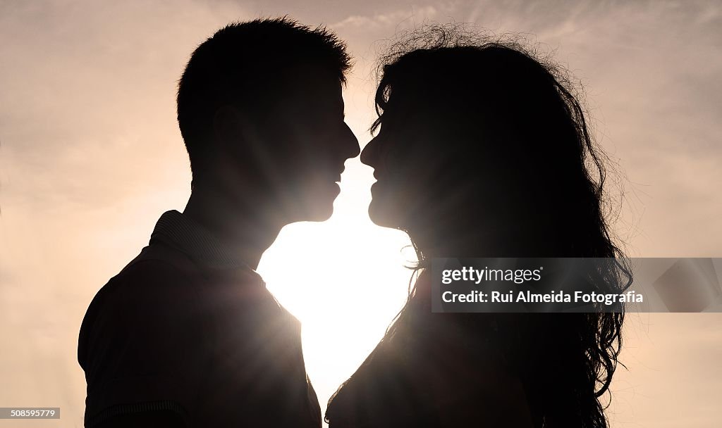 Silhouette of boy and girl romantic