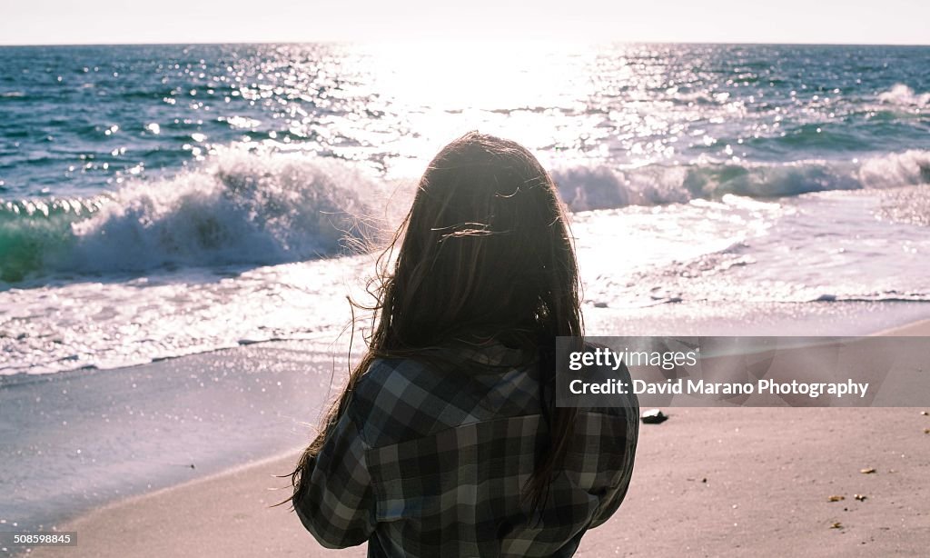 Woman looking out at the ocean