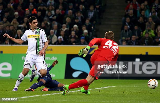 Lars Stindl of Moenchengladbach scores his teams first goal during the Bundesliga match between Borussia Moenchengladbach and Werder Bremen at...