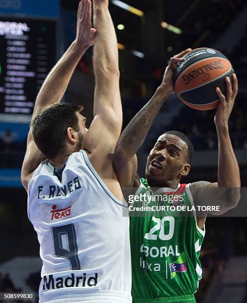 Real Madrid's forward Felipe Reyes vies with Laboral's US guard Darius Adams during the Euroleague group F Top 16 round 6 basketball match Real...