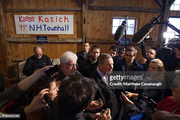 Ohio Governor and Republican presidential candidate John Kasich speaks to the press following a town hall style meeting on February 5, 2016 in...