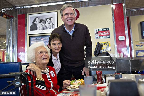 Barbara Bush, former U.S. First lady, left, and her son Jeb Bush, former governor of Florida and 2016 Republican presidential candidate, right, stand...
