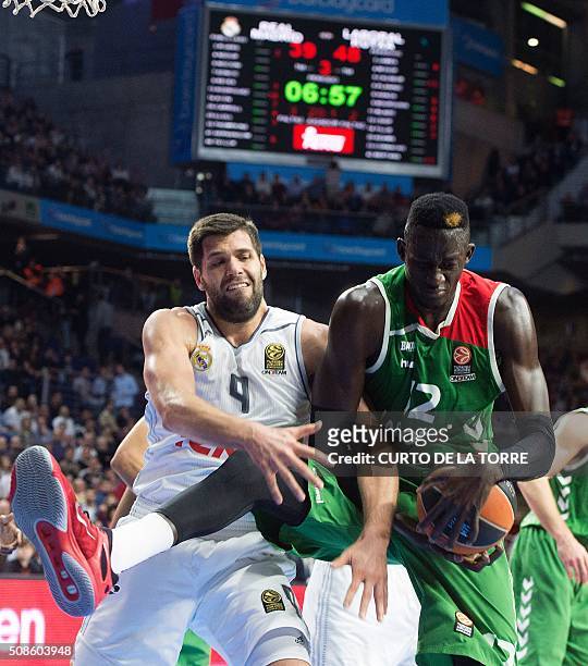 Real Madrid's forward Felipe Reyes vies with Laboral's center Ilimane Diop during the Euroleague group F Top 16 round 6 basketball match Real Madrid...