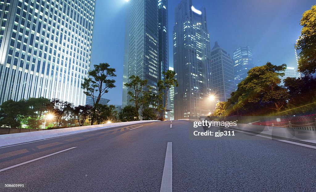 Asphalt road and modern city