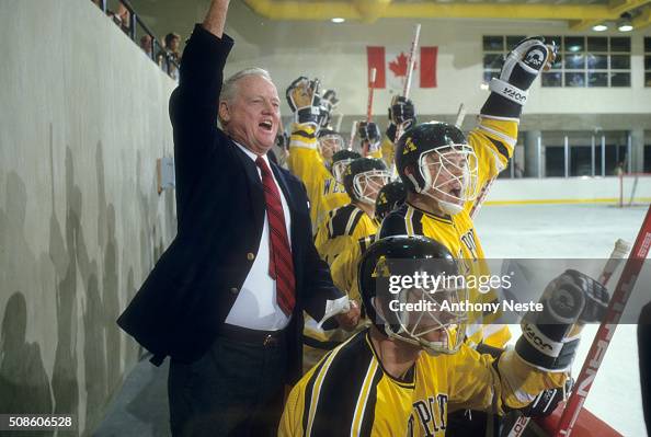 Coach Riley Army Army coach Jack Riley victorious after goal behind players on bench ...