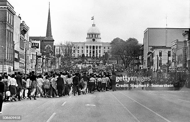 Civil rights marchers round the corner and head up Dexter Avenue towards the Alabama State Capital at the end of the 1965 Selma to Montgomery Civil...