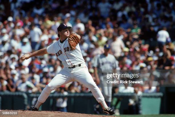 Roger Clemens of the Boston Red Sox pitches against the Seattle Mariners during a game in the 1987 MLB Season at Fenway Park in Boston, Massachusetts.