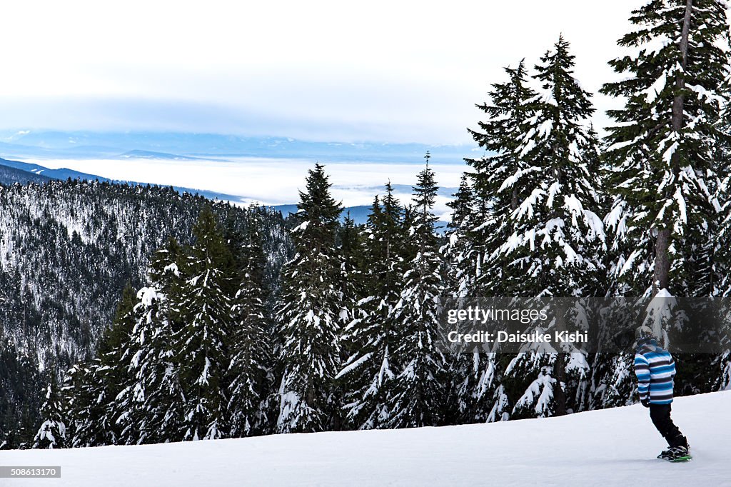 A Snowboarder and the view from Grouse Mountain, Vancouver