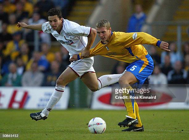 Mark Richards of Northampton is challenged by Rhys Day of Northampton during the Nationwide Division Three Play Off Semi Final, Second Leg between...