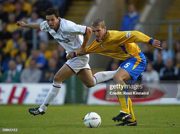 Mark Richards of Northampton is challenged by Rhys Day of Northampton during the Nationwide Division Three Play Off Semi Final, Second Leg between...